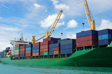 container vessel in tropical harbor