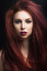 Fototapeta premium girl with bright makeup with the wind in hair.