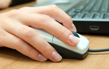 hands fast typing on laptop