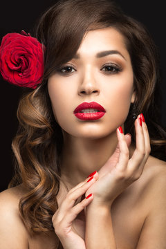 girl in the Spanish of Carmen with red lips and rose