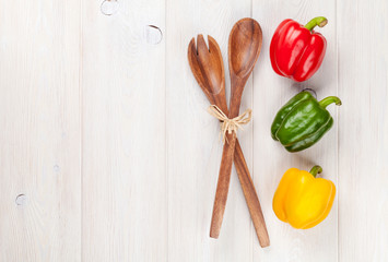 Colorful bell peppers and kitchen utensil