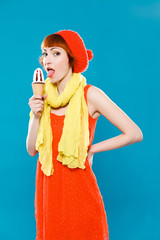 French woman wearing beret. blue background. Girl with ice cream