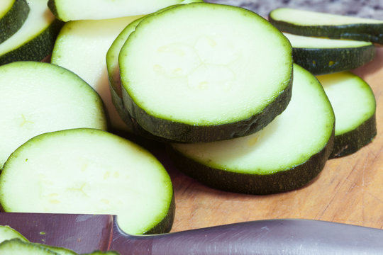 sliced zucchini on a wooden board