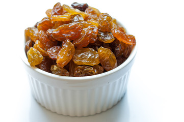 Heap of Raisins on vintage wooden background