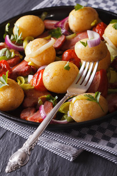 Delicious new potatoes with bacon and onions, vertical 