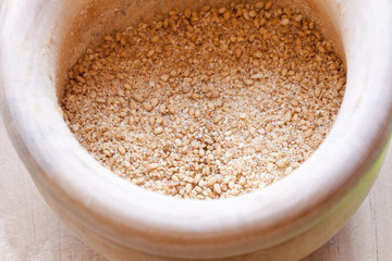Close-up view of organic Gomasio in a ceramic bowl