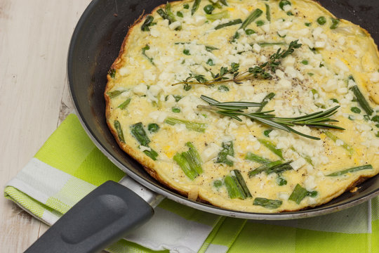 Italian frittata with spring onions and peas