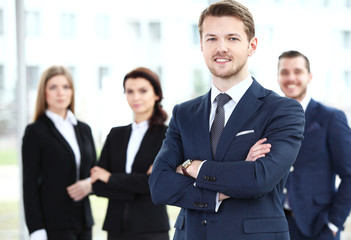 Businessman with colleagues in the background