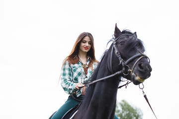 beautiful girl riding a horse