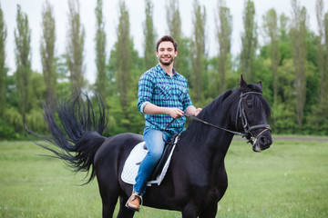 man riding a horse - Powered by Adobe
