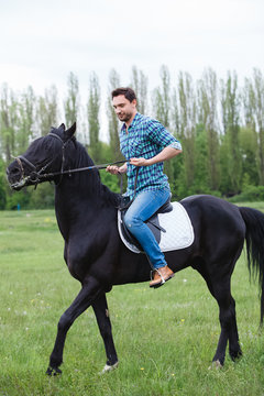 Man Riding A Horse