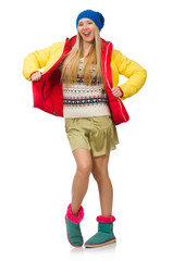 A girl in bright winter clothes isolated on white