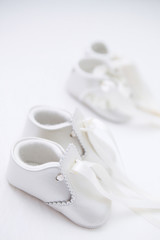 White Baby Shoes on white Blanket
