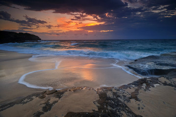 Seascape sunrise with flowing