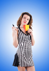 Woman referee with card on white