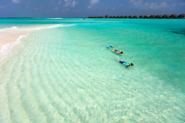 Mother and son snorkeling