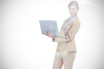 Composite image of confident young businesswoman with laptop