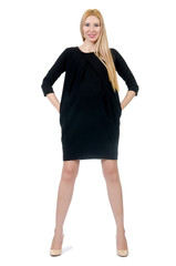 Fototapeta premium Pretty pregnant woman in mini black dress isolated on white