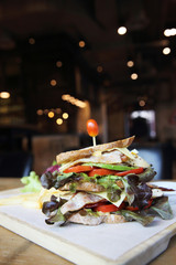 Club sandwich with on wood background