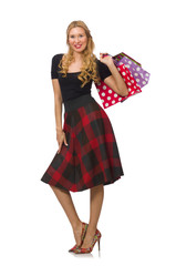 Beautiful young woman in plaid dress isolated on white