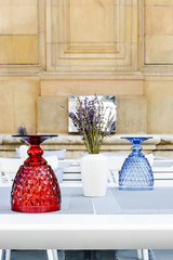 Glass cups on the table in the street cafe