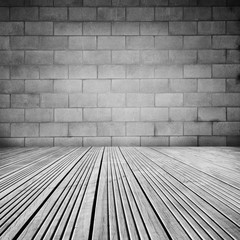 Empty wooden grey floor and block wall