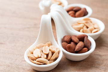 peanut and almond in spoons
