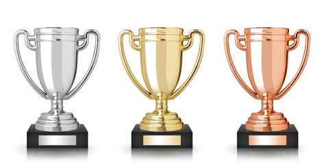 Golden, silver and bronze trophies isolated on white