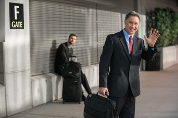 Handsome older man traveling from the airport arrives from a business trip