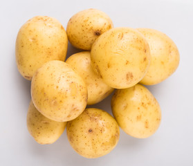 Baby potatoes over white background