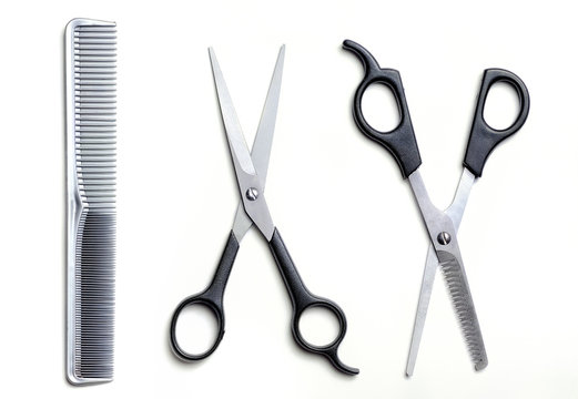 Two open scissors and comb barber isolated