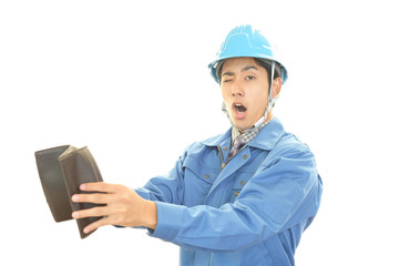 がっかりした表情の労働者