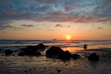 Fototapeta na wymiar Beautiful romantic sunset view from Ayampe beach, Ecuador
