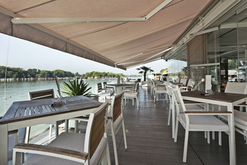 Modern riverside cafe terrace