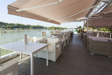 Modern riverside cafe terrace