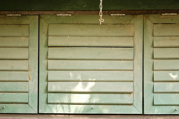 Closed green  wooden windows