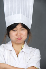 Asian chef in tall toque