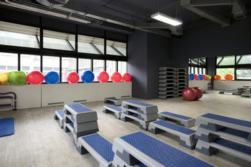 Step boards and pilates balls in gym
