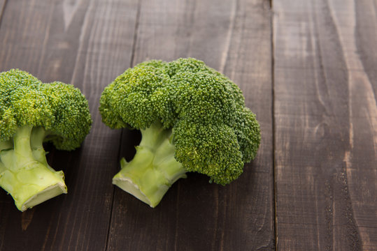 Fresh green broccoli on the wooden background