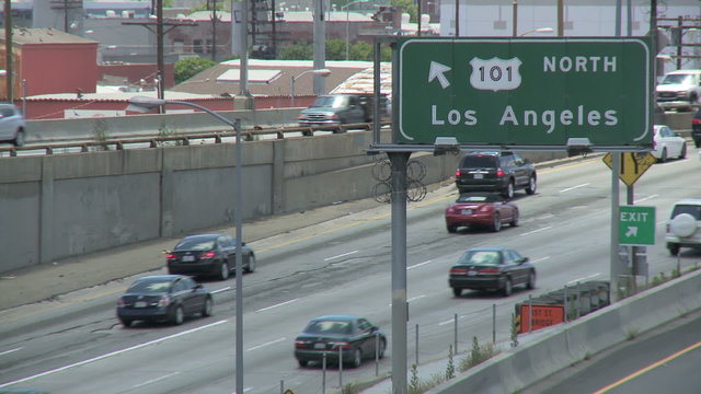 Vehicle traffic drives in and out of downtown on the 101.