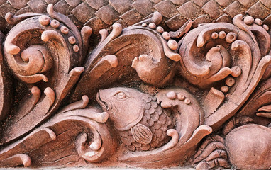 Stucco decorations and flowers striped fish