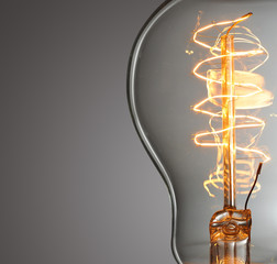 Close up glowing vintage light bulb