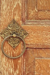 Handle vintage wooden door from an old house.