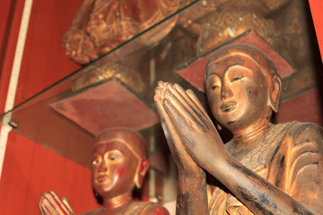 Fototapeta na wymiar Buddha statue with hands clasped