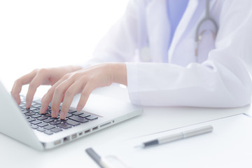 Young and professional doctor working in office