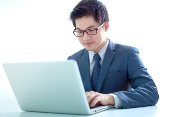 Handsome businessman working with laptop