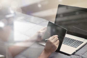 Working with smart phone and computer in bed as concept
