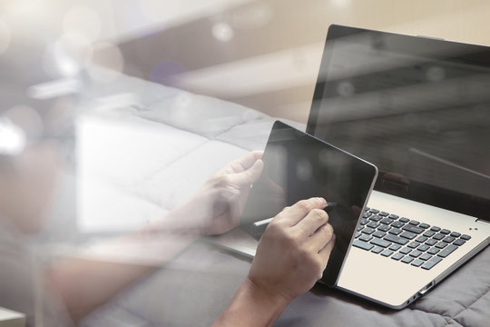 Working with smart phone and computer in bed as concept