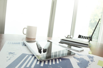 business documents on office table with smart phone and stylus p