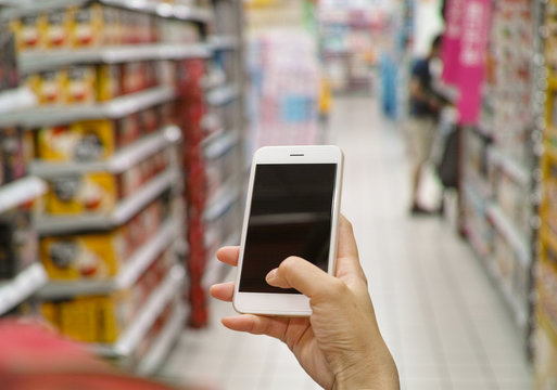 using mobile phone in market